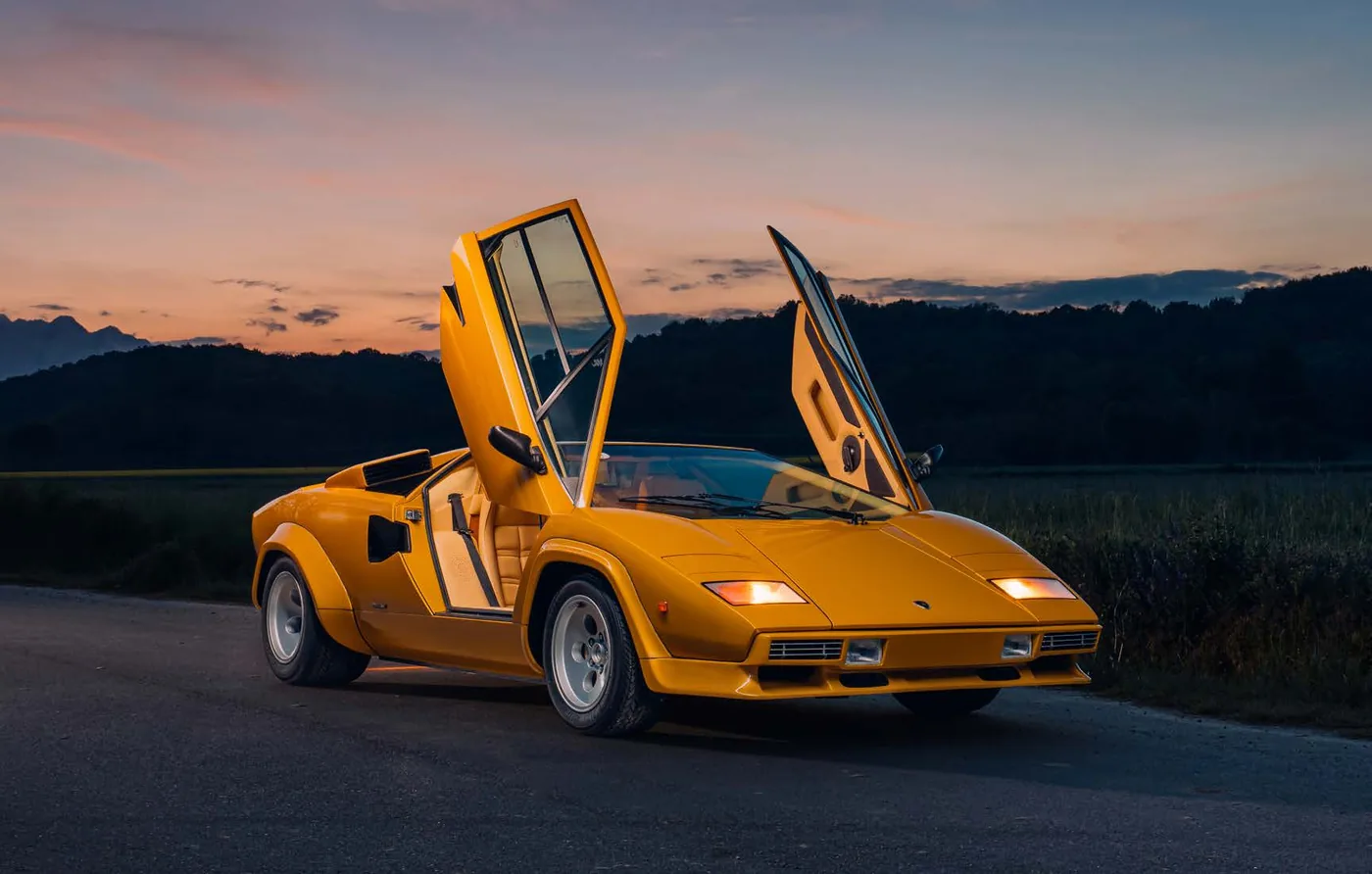 1983 Lamborghini Countach 5000 S by Bertone at dusk, doors raised